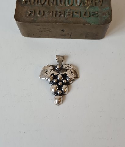Vintage silver pendant in the shape of a bunch of grapes.