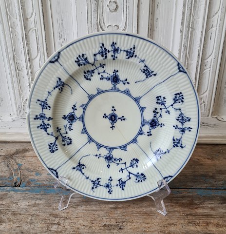 Royal Copenhagen Antique Blue Fluted plate ca year 1800.Diameter 24 cm. Appears with chip.