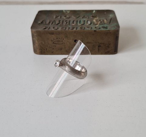 Ring in punched sterling silver with zircon by Hans Henrik Nygaard