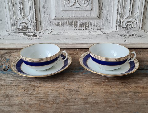 Set of 11 B&G teacups decorated with royal blue, Greek eternity pattern and coat of arms in gold.