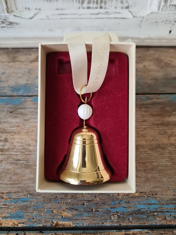 Royal Copenhagen Christmas ornament in the shape of a bell with a white fluted porcelain ball