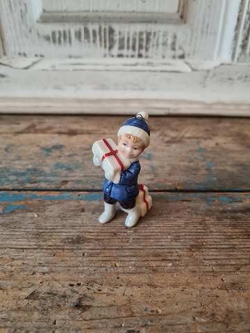 Royal Copenhagen figure - Boy with Christmas presents no. 747