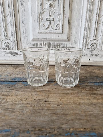 Water glass decorated with moon and stars made of pressed glass