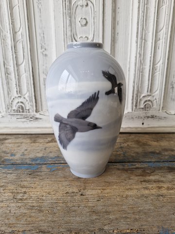 Royal Copenhagen Art Nouveau vase decorated with crows flying over a winter landscape no. 1412/47D