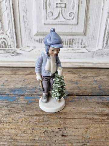 Royal Copenhagen Christmas figurine 2002 Boy with Christmas tree no. 032