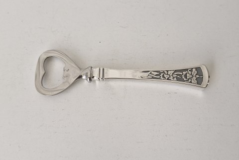 Orchid capsule opener in silver and steel