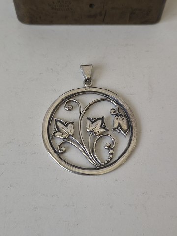 Vintage silver pendant decorated with bell flowers